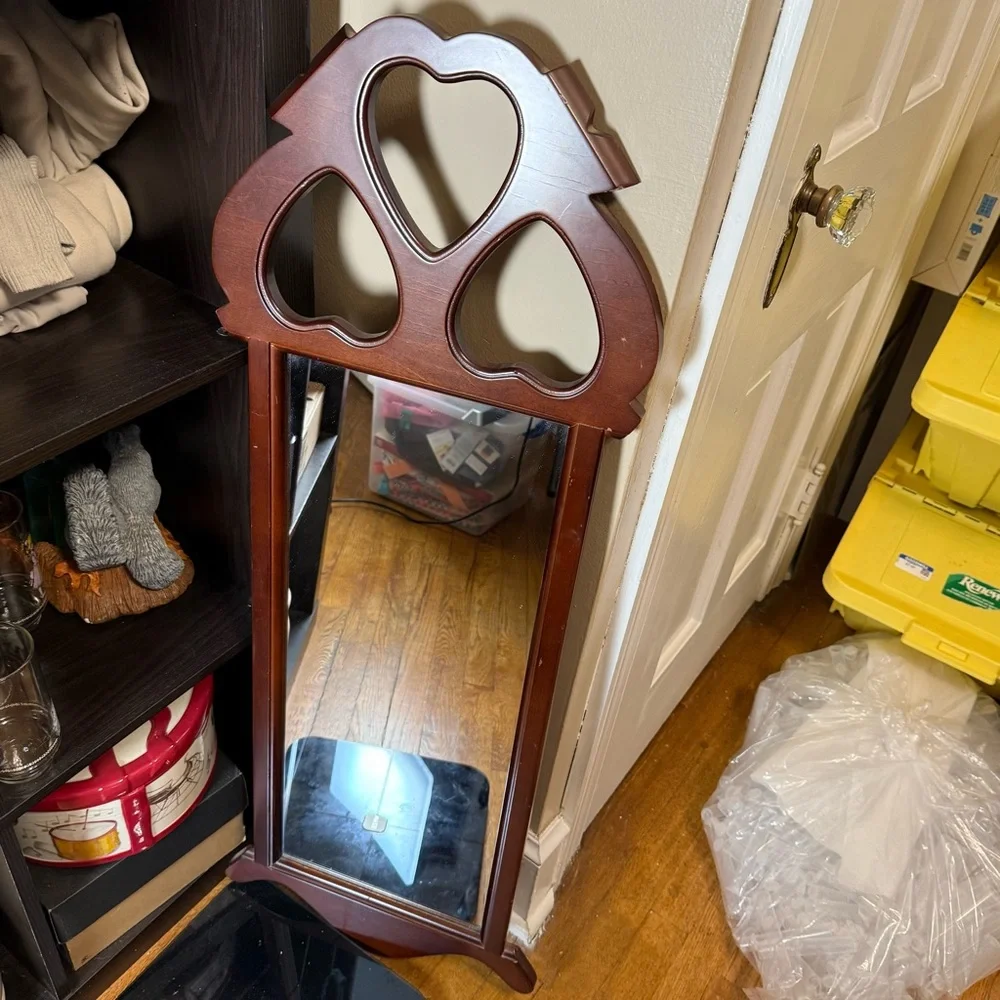 Vintage Dark Finish Wood Frame Mirror with Cut-Out Hearts on Top made by SEI.